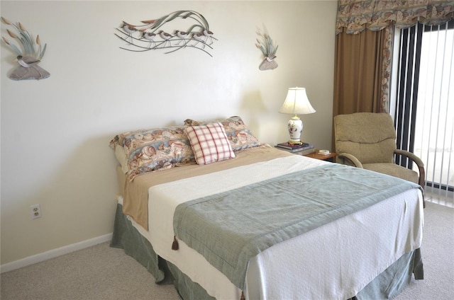4435 S Atlantic Ave Unit 416, Port Orange, FL 32127 - bedroom with carpet flooring and baseboards