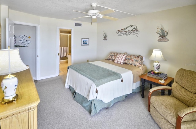 4435 S Atlantic Ave Unit 416, Port Orange, FL 32127 - bedroom featuring carpet flooring, ensuite bathroom, a ceiling fan, and baseboards