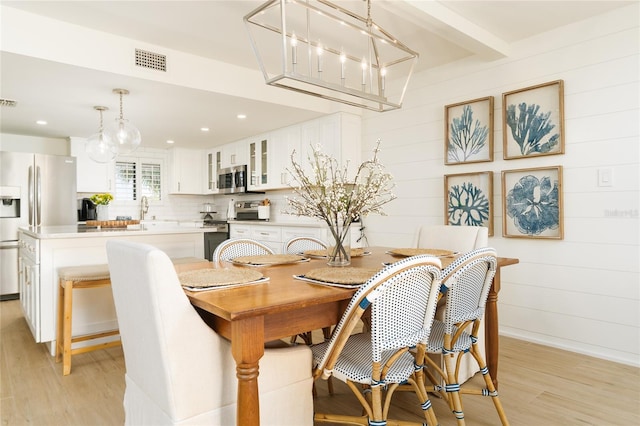 5501 S Atlantic Ave Unit 4090, New Smyrna Beach, FL 32169 - dining room with light wood-style floors, a chandelier, and recessed lighting