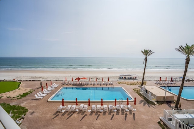 5501 S Atlantic Ave Unit 4090, New Smyrna Beach, FL 32169 - community pool with view of water and beach and a patio area