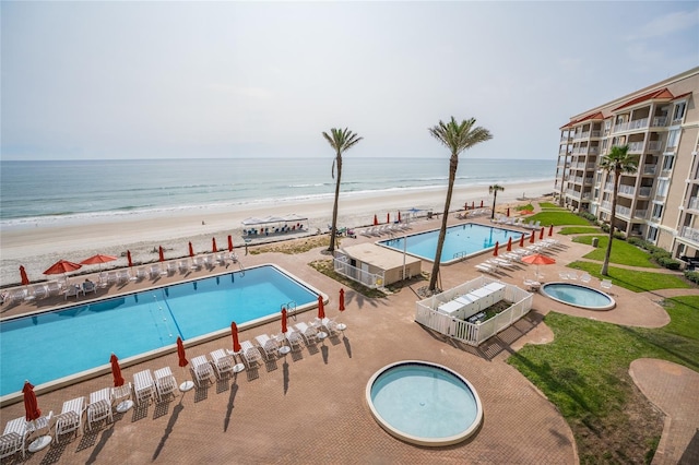 5501 S Atlantic Ave Unit 4090, New Smyrna Beach, FL 32169 - community pool with view of water and beach and a patio