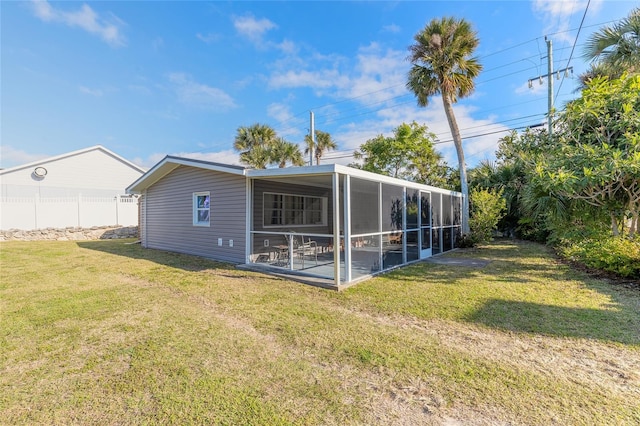 2900 S Peninsula Dr, Daytona Beach, FL 32118 - rear view of house featuring a sunroom
