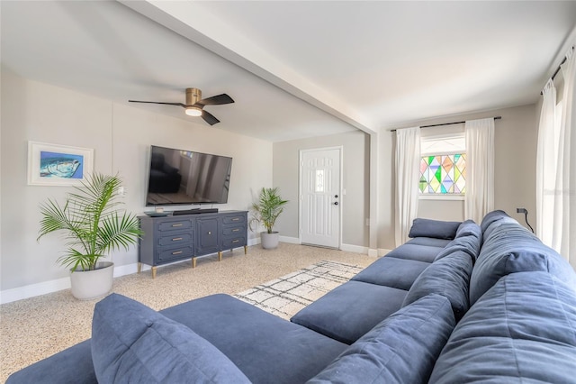 2900 S Peninsula Dr, Daytona Beach, FL 32118 - living area with baseboards, ceiling fan, and dark speckled floor