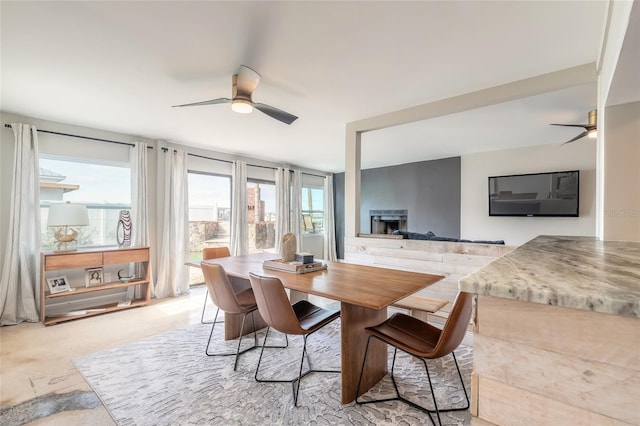 2900 S Peninsula Dr, Daytona Beach, FL 32118 - dining area with a ceiling fan and a fireplace