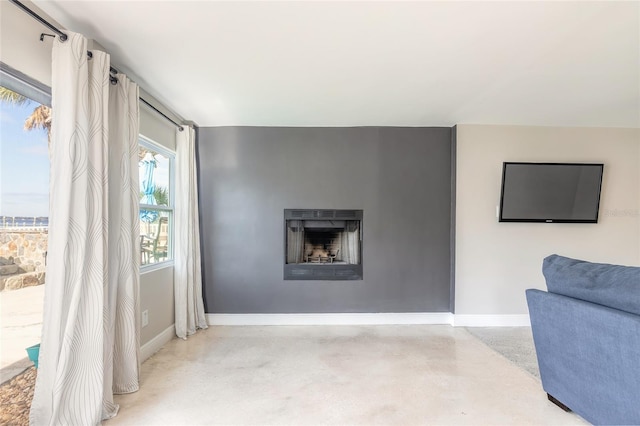 2900 S Peninsula Dr, Daytona Beach, FL 32118 - living room featuring a fireplace and baseboards