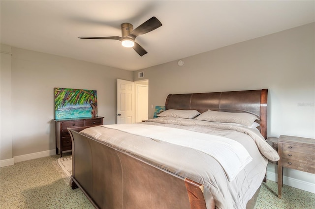 2900 S Peninsula Dr, Daytona Beach, FL 32118 - bedroom with baseboards, a ceiling fan, and dark speckled floor