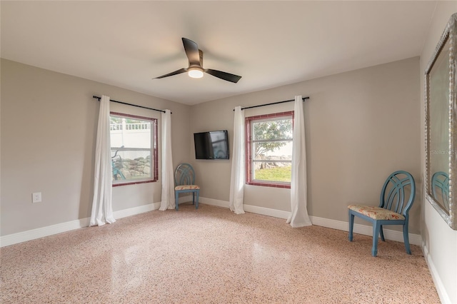 2900 S Peninsula Dr, Daytona Beach, FL 32118 - unfurnished room featuring ceiling fan, speckled floor, and baseboards
