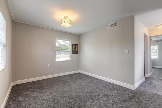 2900 S Peninsula Dr, Daytona Beach, FL 32118 - spare room featuring carpet floors and baseboards