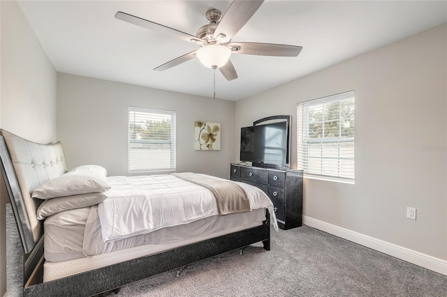 2900 S Peninsula Dr, Daytona Beach, FL 32118 - bedroom with multiple windows, carpet flooring, baseboards, and ceiling fan