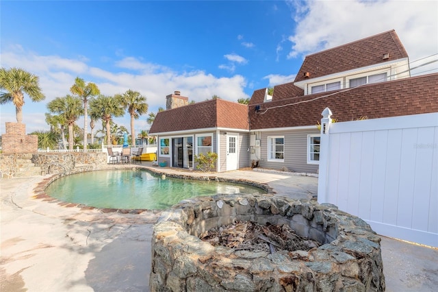 2900 S Peninsula Dr, Daytona Beach, FL 32118 - view of swimming pool with an outdoor fire pit and a patio area