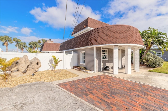 2900 S Peninsula Dr, Daytona Beach, FL 32118 - view of home's exterior featuring roof with shingles