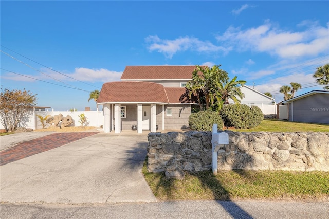2900 S Peninsula Dr, Daytona Beach, FL 32118 - view of front of home featuring driveway and covered porch