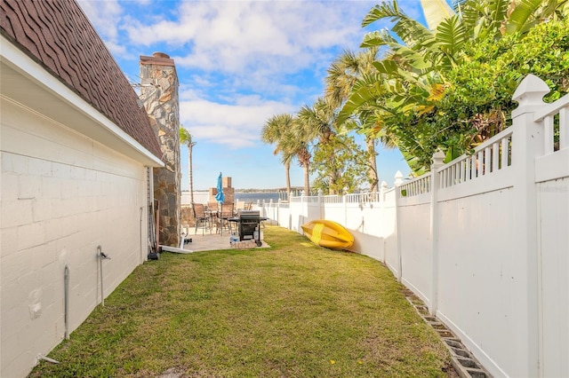 2900 S Peninsula Dr, Daytona Beach, FL 32118 - view of yard featuring a patio area and a water view