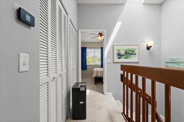 140 Limewood Pl Unit C, Ormond Beach, FL 32174 - hallway featuring carpet floors and an upstairs landing