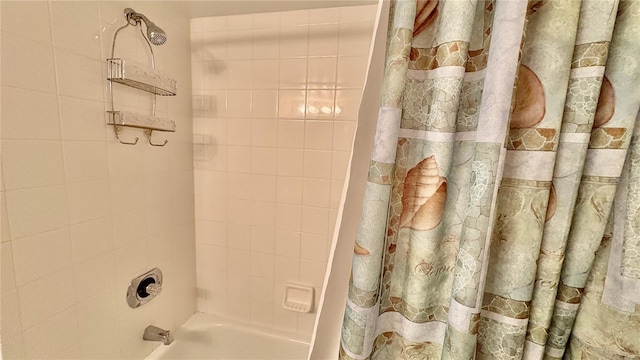 2700 N Peninsula Ave Unit 322, New Smyrna Beach, FL 32169 - bathroom featuring shower / bath combo with shower curtain