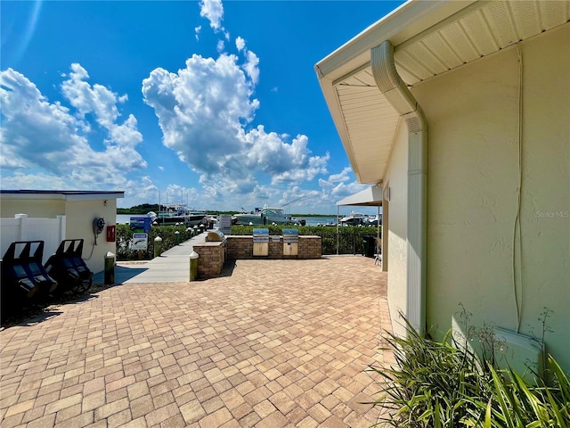 2700 N Peninsula Ave Unit 322, New Smyrna Beach, FL 32169 - view of patio with an outdoor kitchen