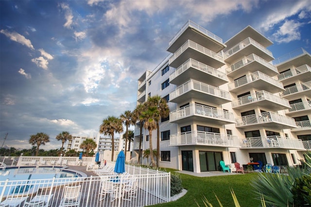 5301 S Atlantic Ave Unit 140, New Smyrna Beach, FL 32169 - view of apartment building / complex featuring a community pool