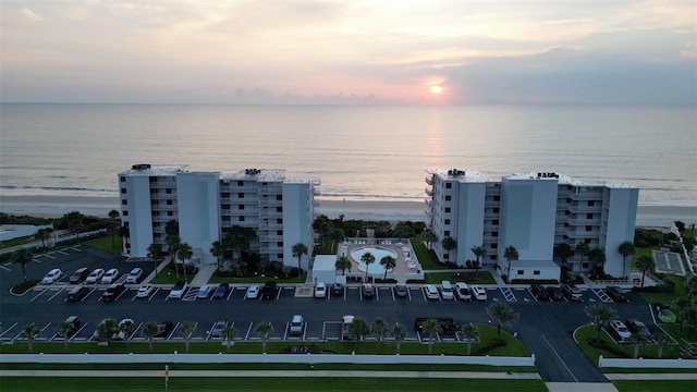 5301 S Atlantic Ave Unit 140, New Smyrna Beach, FL 32169 - aerial view at dusk of a water view and a view of apartment building / complex