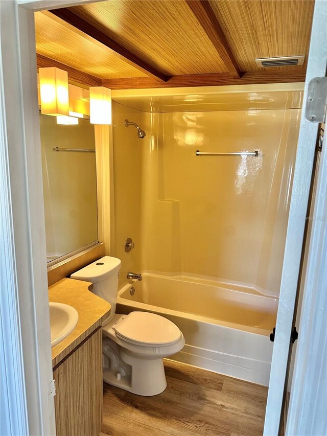 315 N Causeway Unit 2060, New Smyrna Beach, FL 32169 - full bath with wood ceiling, vanity, shower / bathtub combination, toilet, and wood finished floors