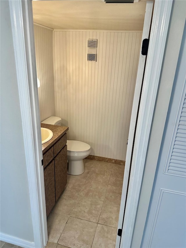 315 N Causeway Unit 2060, New Smyrna Beach, FL 32169 - half bath with vanity, toilet, and tile patterned flooring