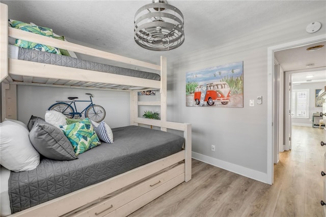 4151 S Atlantic Ave Unit 3090, New Smyrna Beach, FL 32169 - bedroom featuring wood finished floors and baseboards