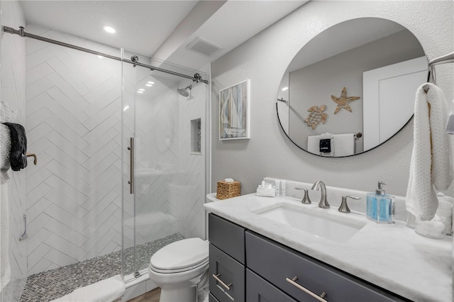4151 S Atlantic Ave Unit 3090, New Smyrna Beach, FL 32169 - bathroom with vanity, toilet, a shower stall, and recessed lighting