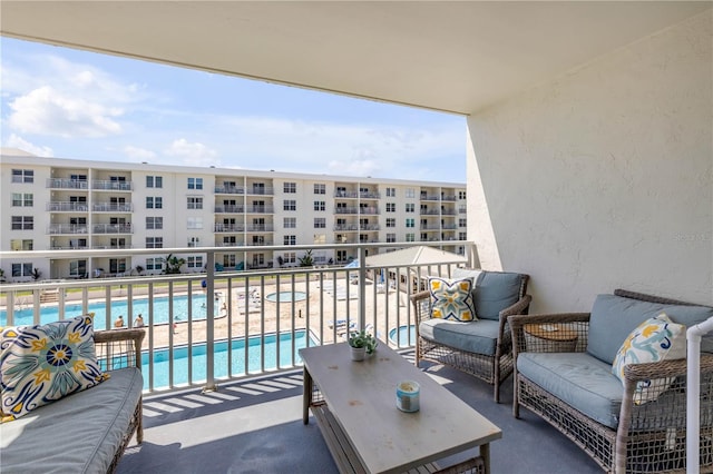 4151 S Atlantic Ave Unit 3090, New Smyrna Beach, FL 32169 - balcony with view of pool and an outdoor living space