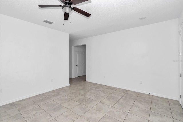 7223 SW 61st Pl, Ocala, FL 34474 - spare room with a ceiling fan, a textured ceiling, and light tile patterned flooring