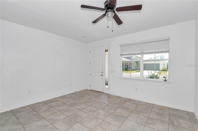 7223 SW 61st Pl, Ocala, FL 34474 - empty room with light tile patterned flooring, ceiling fan, and a textured ceiling