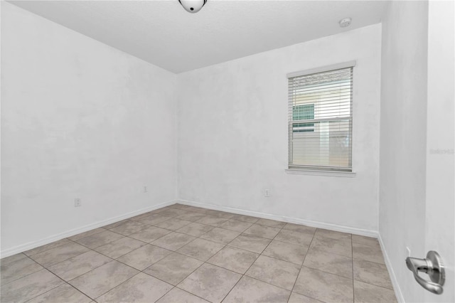 7223 SW 61st Pl, Ocala, FL 34474 - unfurnished room with light tile patterned floors and a smoke detector