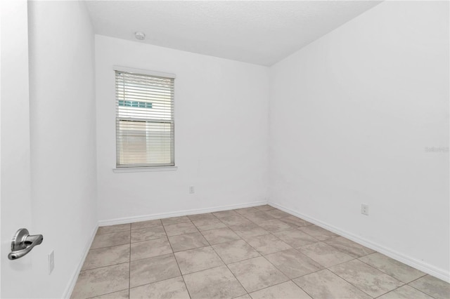 7223 SW 61st Pl, Ocala, FL 34474 - unfurnished room with light tile patterned flooring and a smoke detector