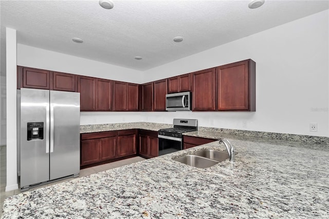 7223 SW 61st Pl, Ocala, FL 34474 - kitchen featuring stainless steel appliances, dark brown cabinets, light stone countertops, and a textured ceiling