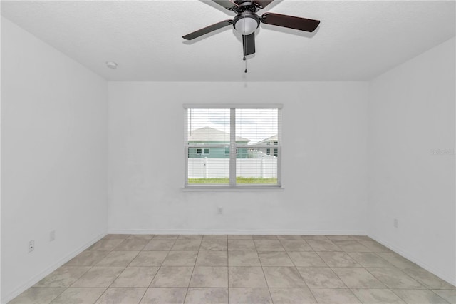 7223 SW 61st Pl, Ocala, FL 34474 - spare room featuring ceiling fan, a textured ceiling, and light tile patterned flooring