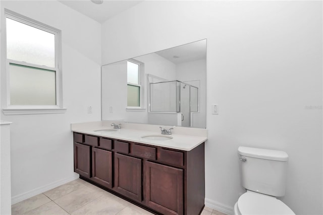 7223 SW 61st Pl, Ocala, FL 34474 - bathroom with double vanity, a shower with shower door, and tile patterned flooring