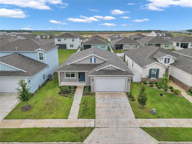 7223 SW 61st Pl, Ocala, FL 34474 - view of front of home with a residential view, a garage, driveway, and a front yard