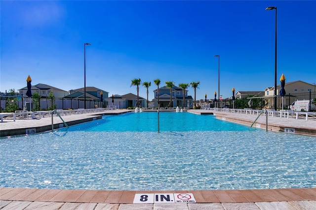 7223 SW 61st Pl, Ocala, FL 34474 - community pool featuring a patio area and a residential view