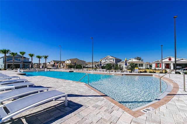 7223 SW 61st Pl, Ocala, FL 34474 - community pool with a residential view and a patio