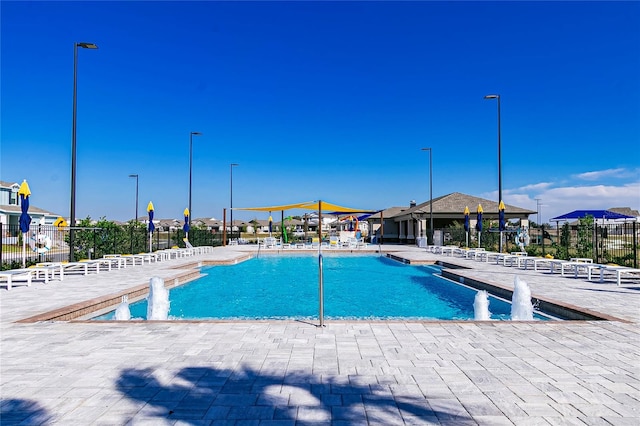 7223 SW 61st Pl, Ocala, FL 34474 - community pool with a patio