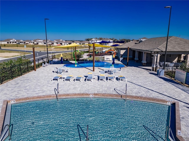 7223 SW 61st Pl, Ocala, FL 34474 - community pool featuring a residential view