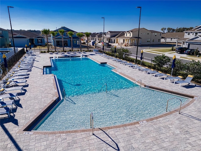 7223 SW 61st Pl, Ocala, FL 34474 - community pool featuring a residential view and a patio