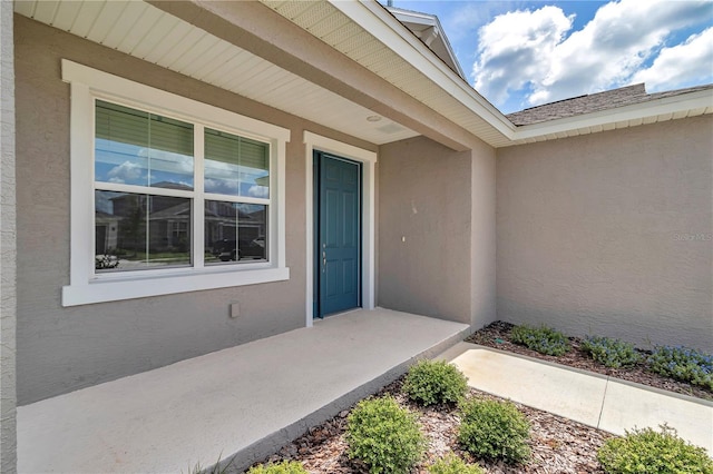 7223 SW 61st Pl, Ocala, FL 34474 - doorway to property featuring stucco siding and covered porch