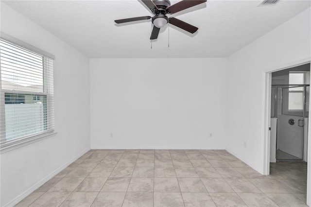 7223 SW 61st Pl, Ocala, FL 34474 - spare room featuring a ceiling fan, light tile patterned floors, and a textured ceiling