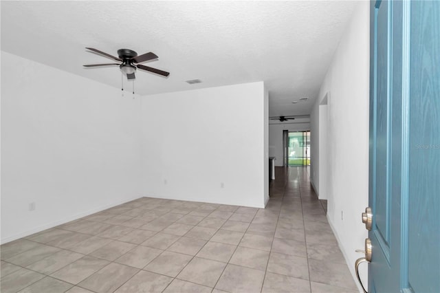 7223 SW 61st Pl, Ocala, FL 34474 - unfurnished room with a ceiling fan, a textured ceiling, and light tile patterned floors