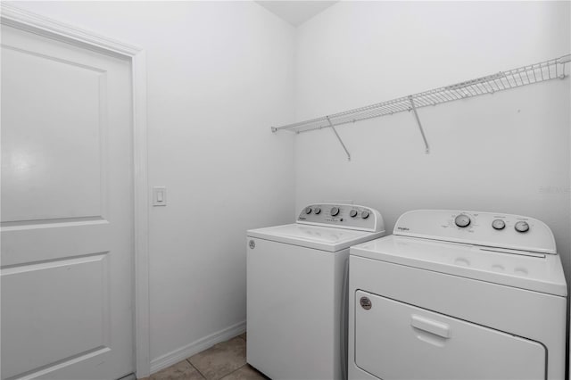 7223 SW 61st Pl, Ocala, FL 34474 - laundry room with washing machine and dryer and light tile patterned floors