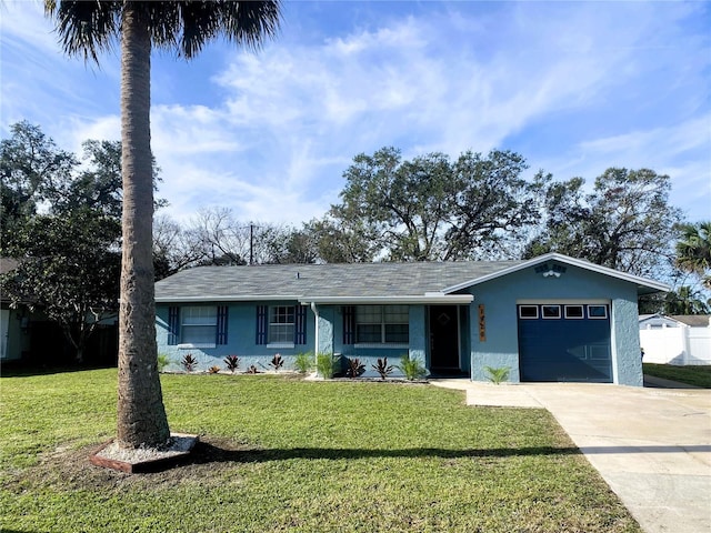 1920 Travelers Palm Dr, Edgewater, FL 32141 - ranch-style house featuring an attached garage, stucco siding, a front yard, and concrete driveway