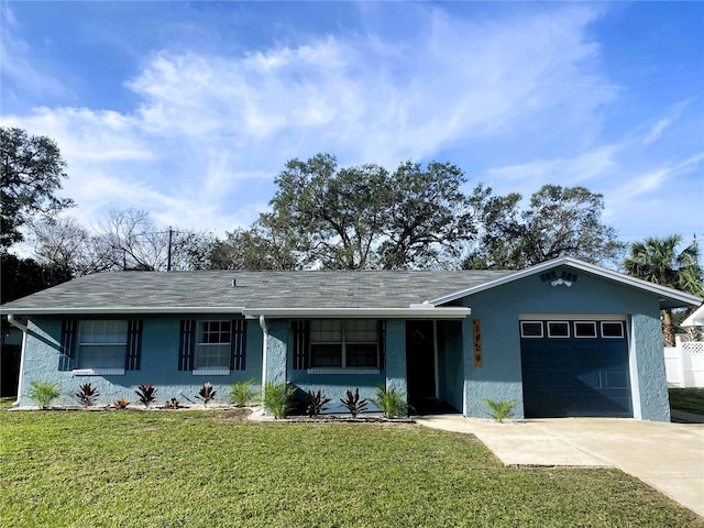 1920 Travelers Palm Dr, Edgewater, FL 32141 - single story home with an attached garage, driveway, a front lawn, stucco siding, and roof with shingles