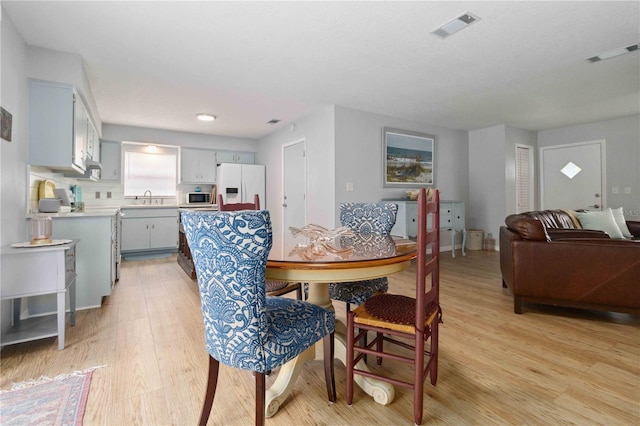 1920 Travelers Palm Dr, Edgewater, FL 32141 - dining area featuring light wood-style flooring