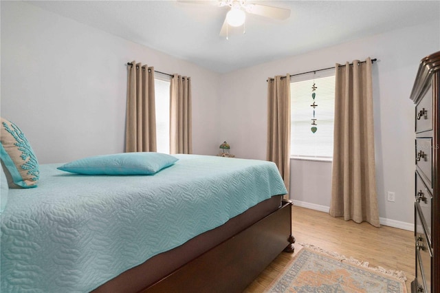 1920 Travelers Palm Dr, Edgewater, FL 32141 - bedroom with multiple windows, light wood-style flooring, and a ceiling fan