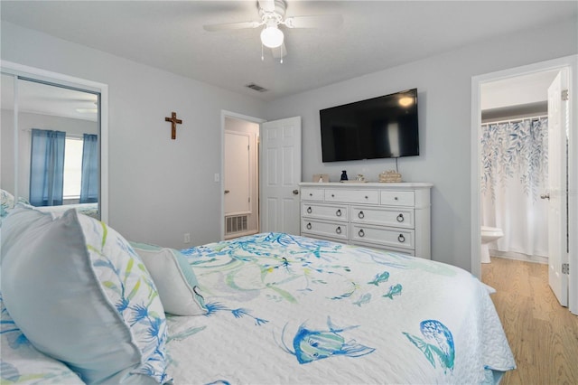 1920 Travelers Palm Dr, Edgewater, FL 32141 - bedroom featuring light wood-style flooring, ceiling fan, and ensuite bath