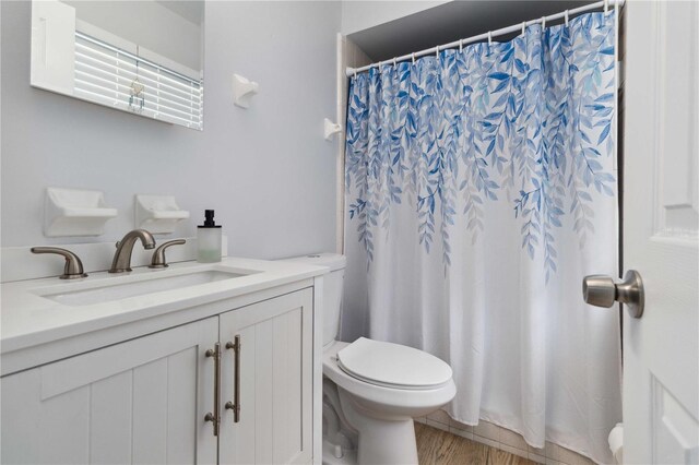 1920 Travelers Palm Dr, Edgewater, FL 32141 - full bathroom featuring vanity, wood finished floors, and a shower with curtain